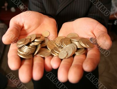 Two palms handful of metall money coins