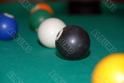 billiards table with pool balls