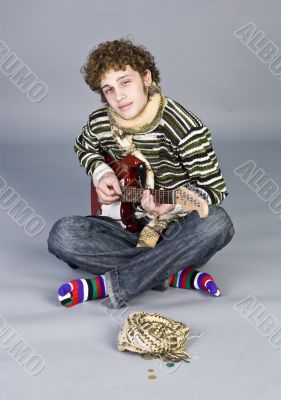 Betiful young man with guitar