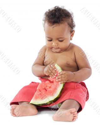Baby eating watermelon