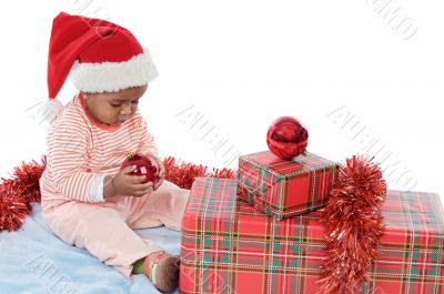 baby girl with christmas presents
