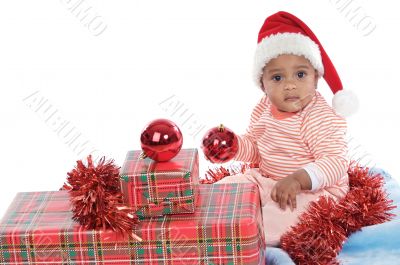baby girl with christmas presents