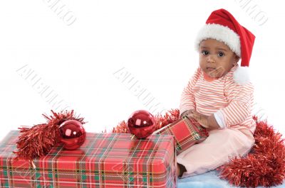 baby girl with christmas presents