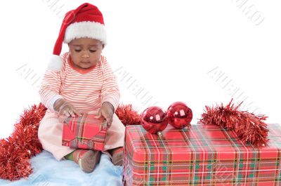 baby girl with christmas presents