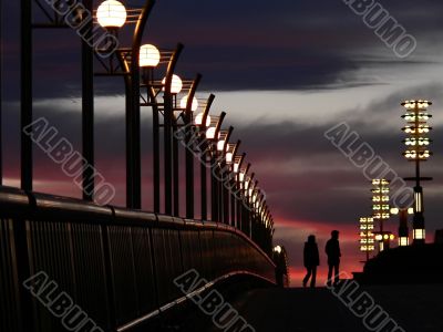 walking couple and evening sky
