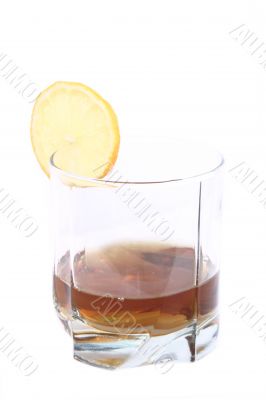 Cognac in a glass, with lemon