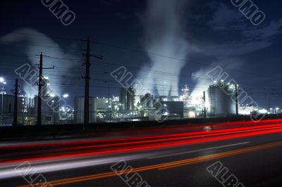 Cars passing by at oil refinery