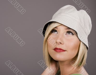 Blonde in White Hat Looking Up