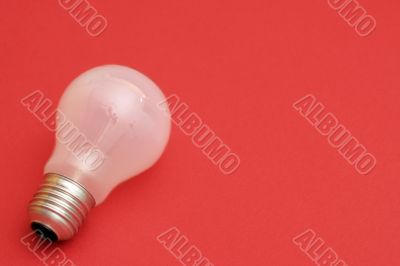 Background with lit lightbulb