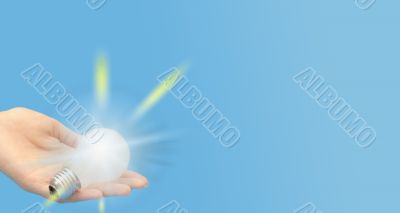 Background with lit lightbulb