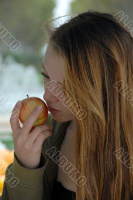 young girl and red apple