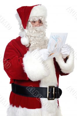Santa Claus looking a drawing