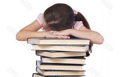 girl asleep on books