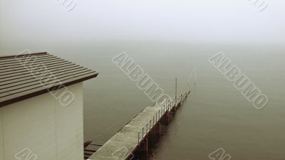old pier in mist