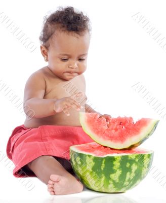 Baby eating watermelon