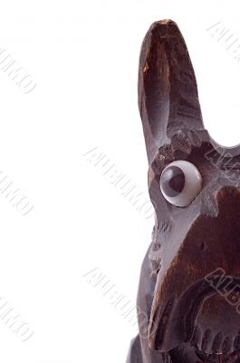 The head of wooden toy dog. Half view