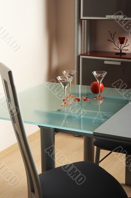 Three glasses and apple