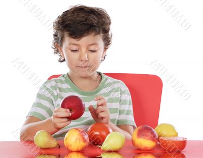 child playing with fruits