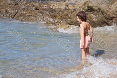 boy playing in the beach