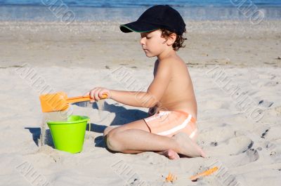 boy playing in the beach