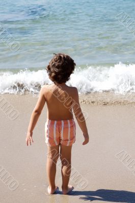  boy playing in the beach