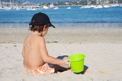 boy playing in the beach