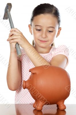 adorable boy breaking the money box