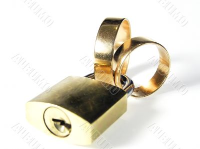 Padlock and wedding rings