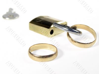 Padlock and wedding rings