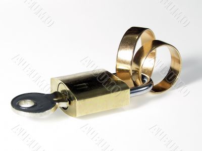 Padlock and wedding rings