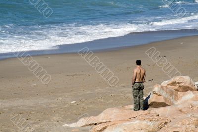 Young men watching the sea