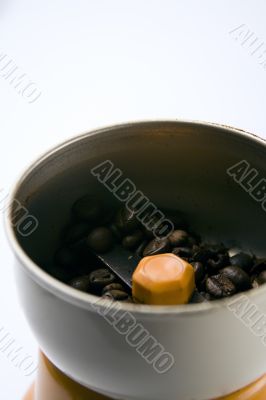 Grain coffee in a grinder