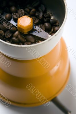 Grain coffee in a grinder
