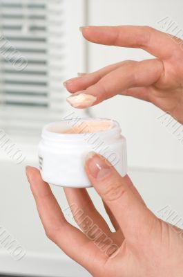 Cream in woman hands