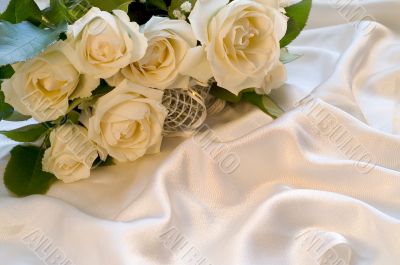 White wedding rose on silk background