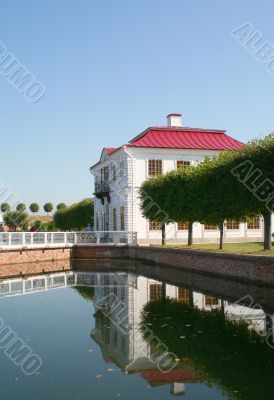 white  house with red roof