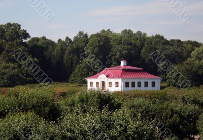 white  house with red roof