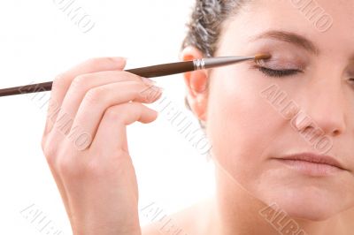 Applying eye shadow