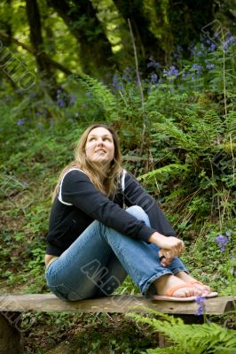 Beautiful brunette sitting outdoors