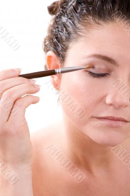 Applying eyeshadow