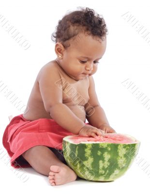 Baby eating watermelon
