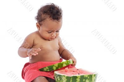 Baby eating watermelon