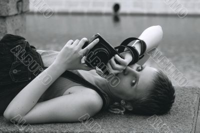 Young sexy woman with the camera