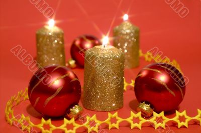 Gold candles and red glass balls
