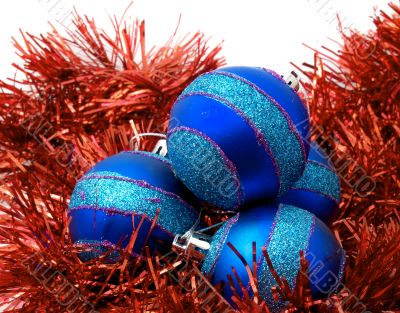 Christmas blue ornaments and red tinsel