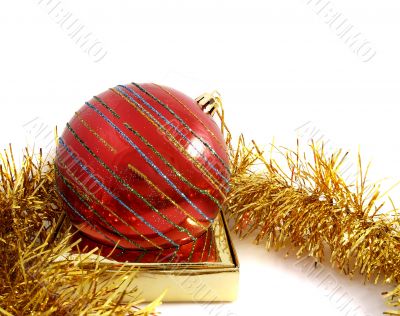 Christmas red ornaments and gold tinsel