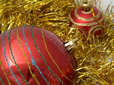 Christmas red ornaments and gold tinsel