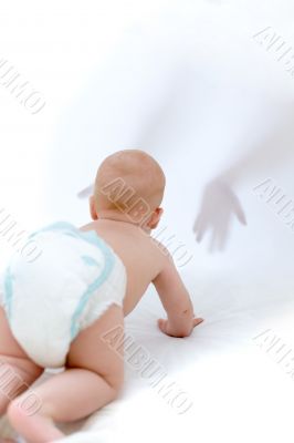 Baby crawling to unfamiliar hands