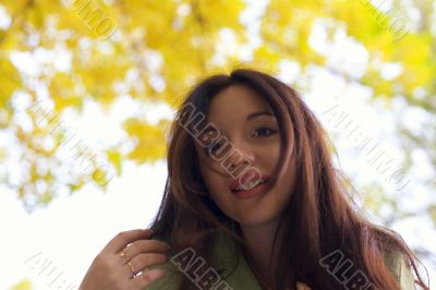 Woman peek from above on camera in autumn park