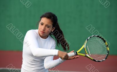 Girl playing tennis